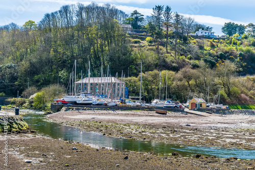 A view across the harbour towards Lower Fishguard, South Wales on a sunny day photo