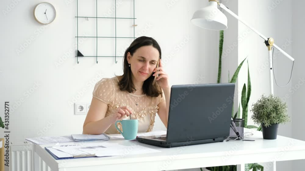 Businesswoman Talking on the Phone and Drinking Tea in the Office. Business, Lifestyle and People Concept