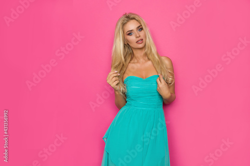 Beautiful Blond Woman In Turquoise Dress.