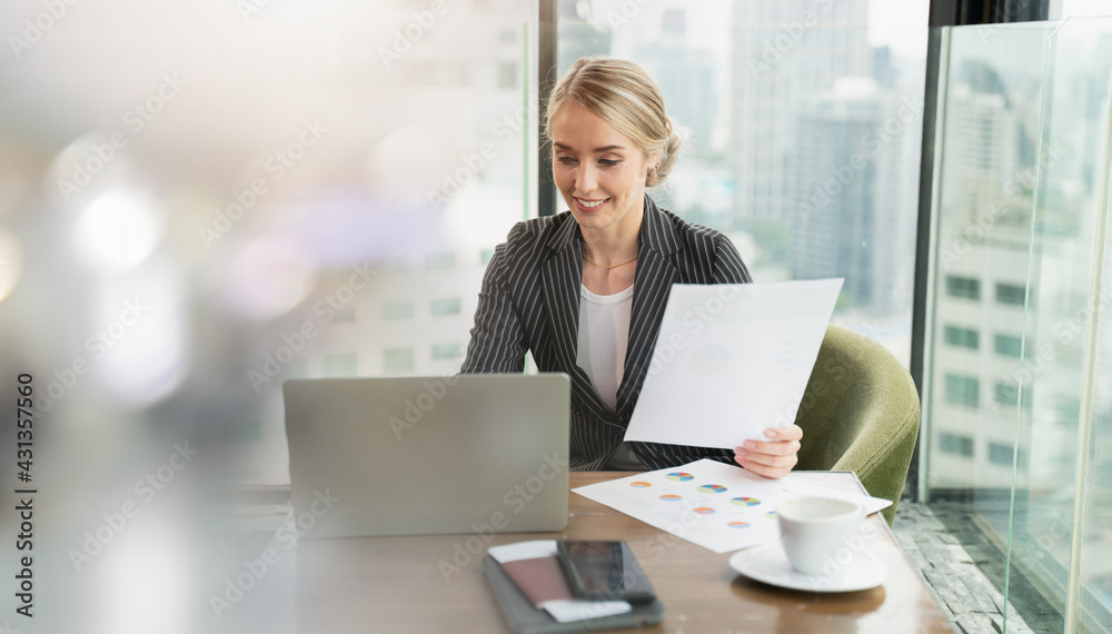 businesswoman working in office. Business woman Brown hair was reading a papers with happy gestures and smiles.