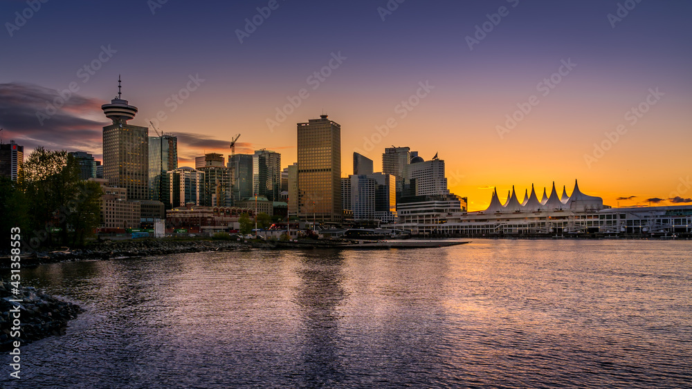 Sunset over the Harbor and the Sails of Canada Place, the Cruise Ship Terminal and Convention Center on the Waterfront of Vancouver, British Columbia, Canada