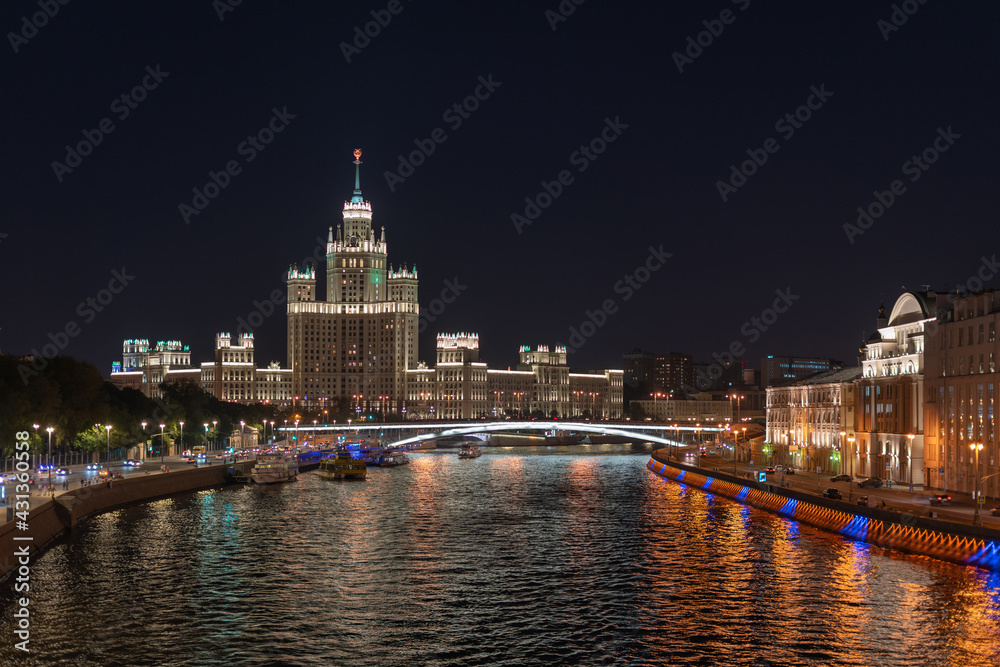 Naklejka premium View cityscape Moscow by night. High-rise on Kotelnicheskaya embankment on Moskva-river.