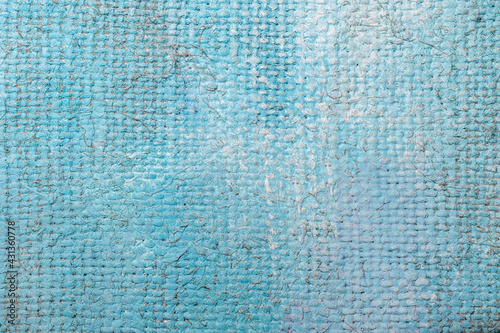 Rough canvas texture in blue tones of oil paint.