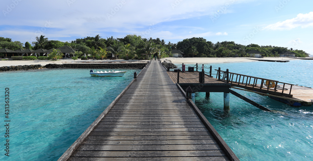 long wooden pier in the Indian Ocean