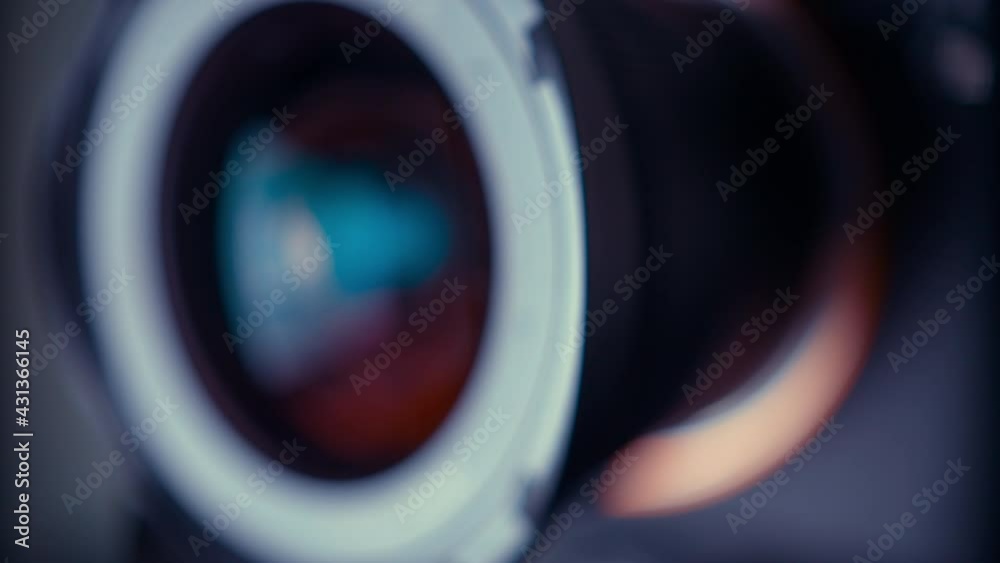 the lens of a movie camera or photo camera is shot in close-up