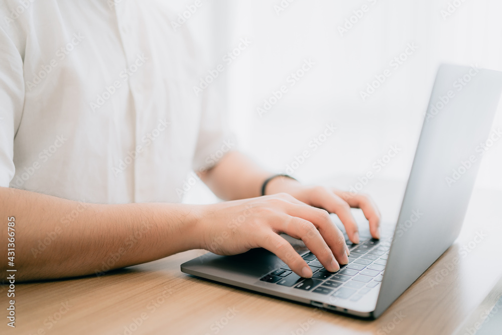 Smart asian working businessman typing keyboard for browsing internet and sending email with computer laptop, selective focus on male hand, man employee operator worker business job concept Smart asian working businessman typing keyboard for browsing internet and sending email with computer laptop, selective focus on male hand, man employee operator worker business job concept