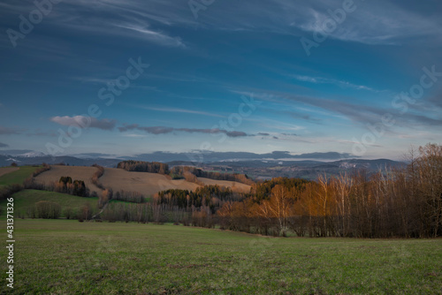 Sunset view in Roprachtice village in Krkonose mountains with color sky photo