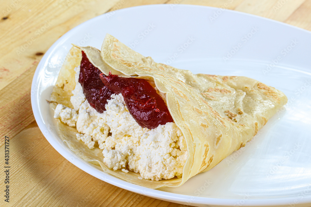 Pancake with cottage cheese and jam