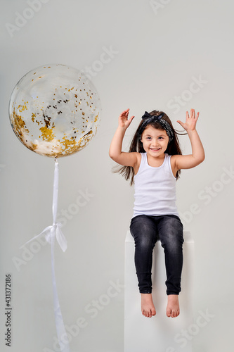 little funny girl e on a white background with a balloon © Гульнара Мандрыкина
