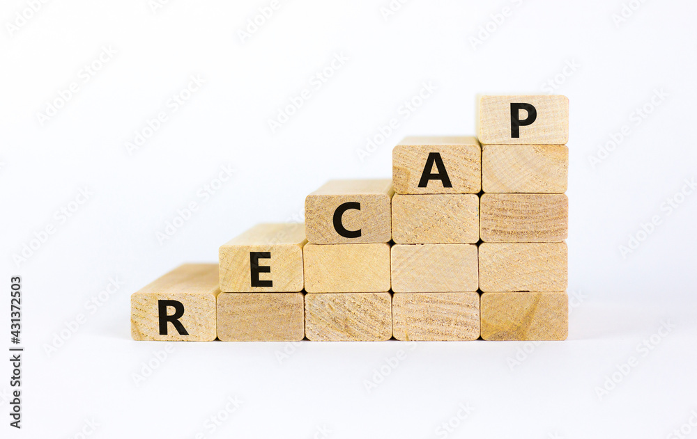 Recap symbol. The word 'recap' on wooden cubes on beautiful white