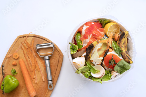 Food waste from domestic kitchen Responsible disposal of household food wastage in an environnmentally friendly way by recycling in compost bin at home photo