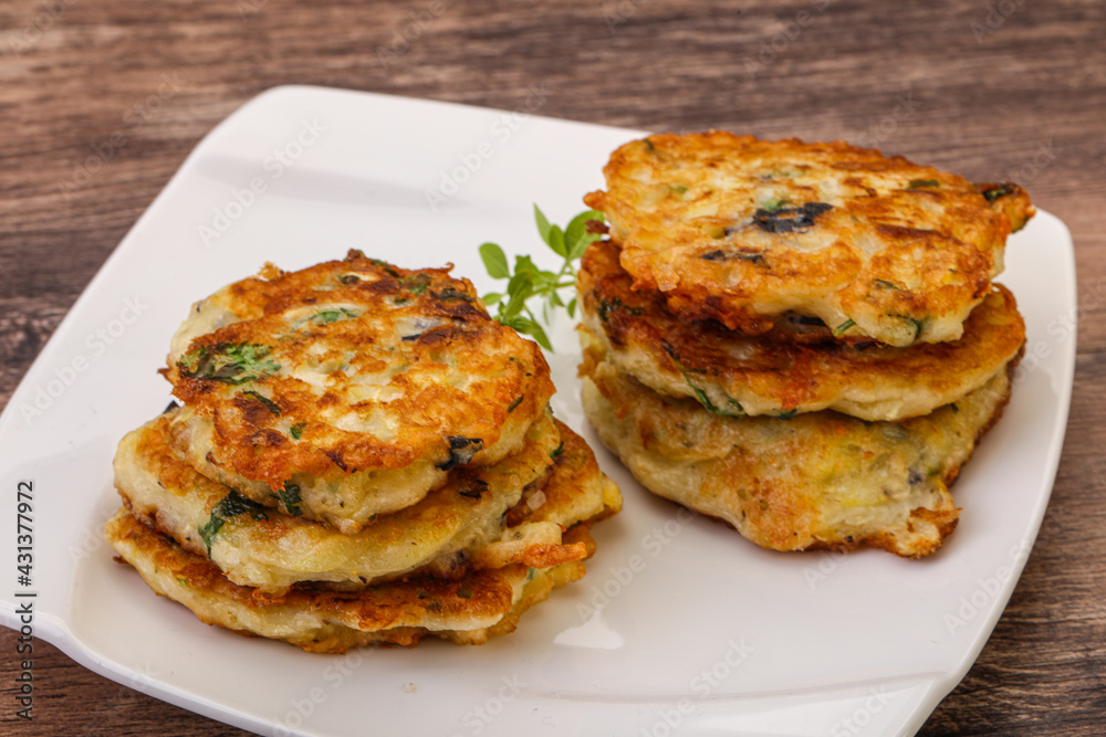Zucchini pancakes with herbs and spices