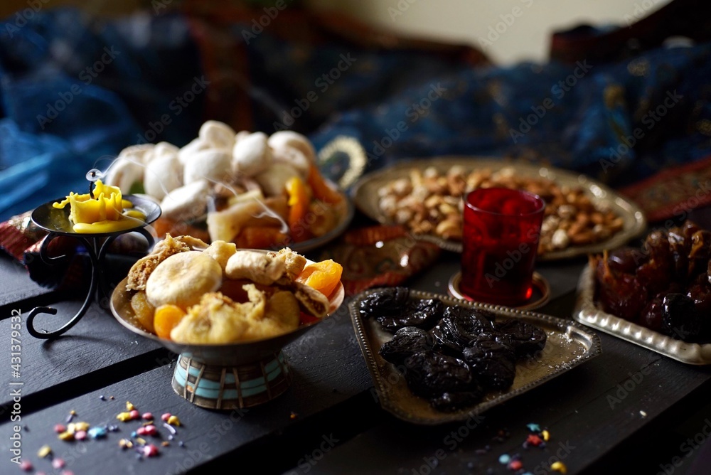 Eastern sweets. Dried fruits. Nuts. Haze from an extinguished candle. Eastern sweets. Dried fruits. Nuts. Haze from an extinguished candle.