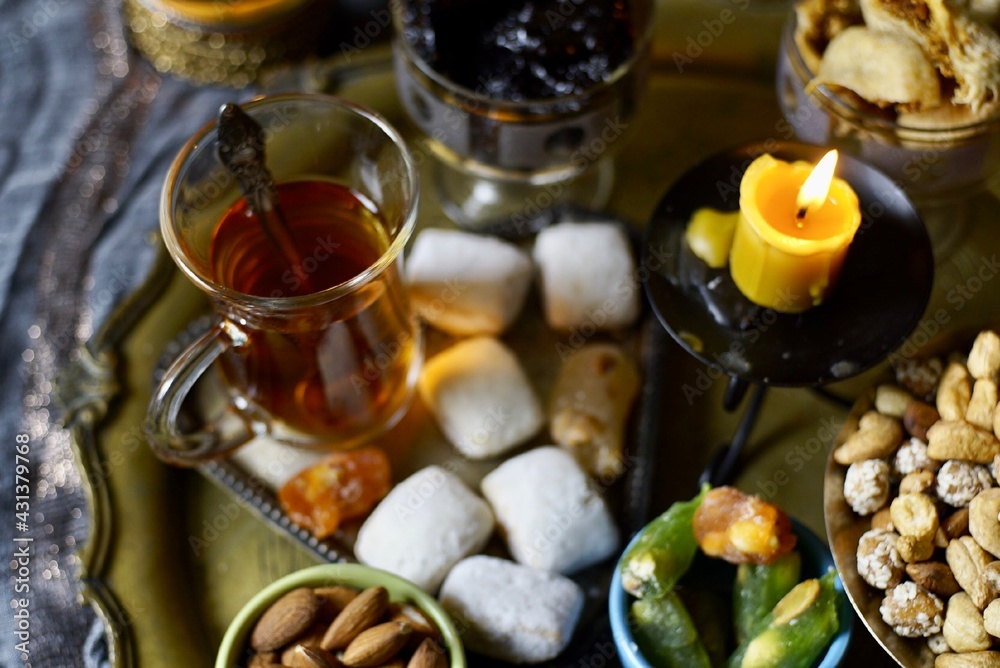 Eastern table. Dried fruits. Mix of nuts, dried apricots, Turkish delight, dates, figs, sweets. Eastern table. Dried fruits. Mix of nuts, dried apricots, Turkish delight, dates, figs, sweets.