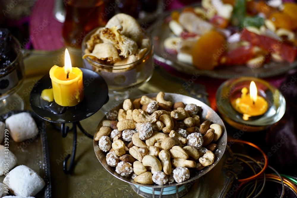 Plate with mix nuts on a eastern styled table Plate with mix nuts on a eastern styled table