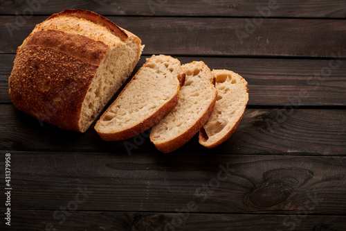 Homemade tartine bread on dark wooden table