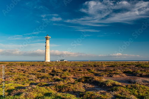 Morro Jable Lighthouse, Fuerteventura, Spain. Place of scientist interest "Saladar de la Playa del Matorral" is the world of the salt marsh with its salt-tolerant plants at Jandía Peninsula