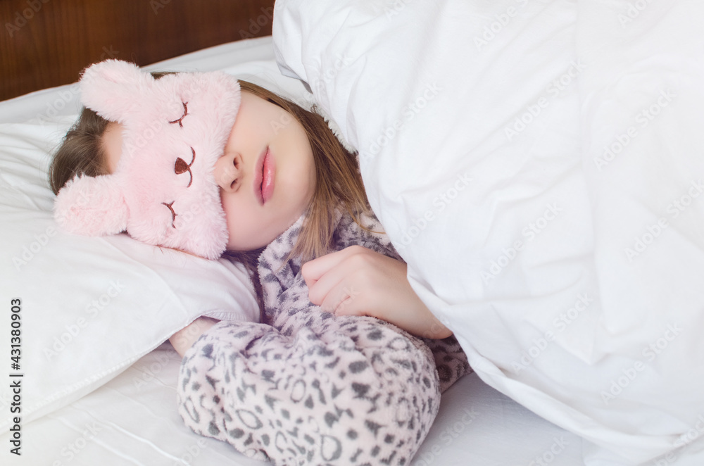 Beautiful young woman in cute sleep mask Beautiful young woman in cute sleep mask