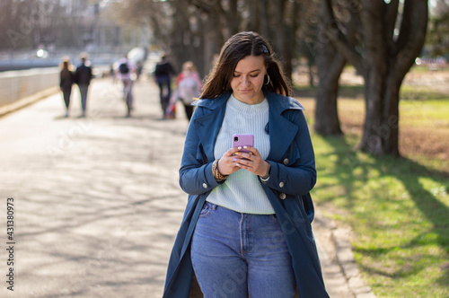 young girl uses a mobile. girl's telephone correspondence