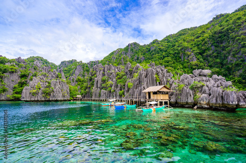 Twin Lagoon on paradise island with sharp limestone rocks, tropical travel destination - Coron, Palawan, Philippines.