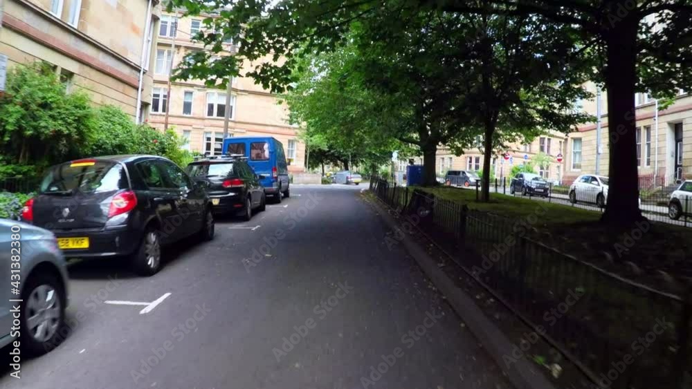 Panning From A Car The Historic Victorian Apartment Homes Of Downtown Glasgow Along A Tree-Lined Street Panning From A Car The Historic Victorian Apartment Homes Of Downtown Glasgow Along A Tree-Lined Street