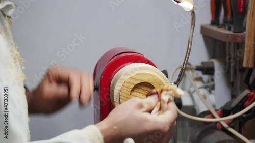 Cabinetmaker polishing and polishing piece of wood