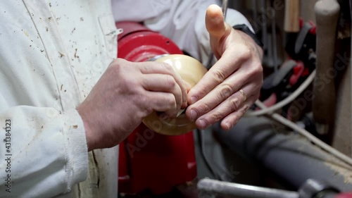 Cabinetmaker polishing and polishing piece of wood