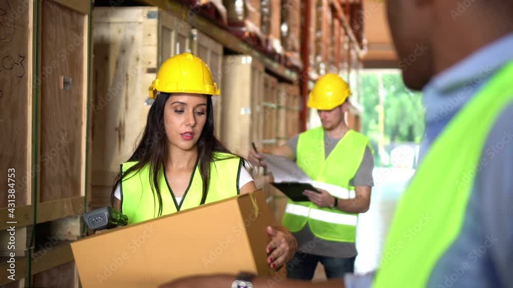 Slow motion Young woman worker use barcode scanner and clipboard to check product box shelf stock and man worker helper in warehouse which smile happy, logistic import and export transportation Slow motion Young woman worker use barcode scanner and clipboard to check product box shelf stock and man worker helper in warehouse which smile happy, logistic import and export transportation