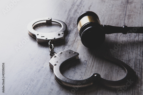 Legal law concept image - gavel and handcuffs photo