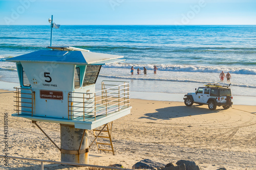 Torrey Pines State Natural Reserve Beach Lifeguard Tower and  Lifeguard Patrol Jeep with the Ocean Waves in La Jolla, California, Located in San Diego County.	