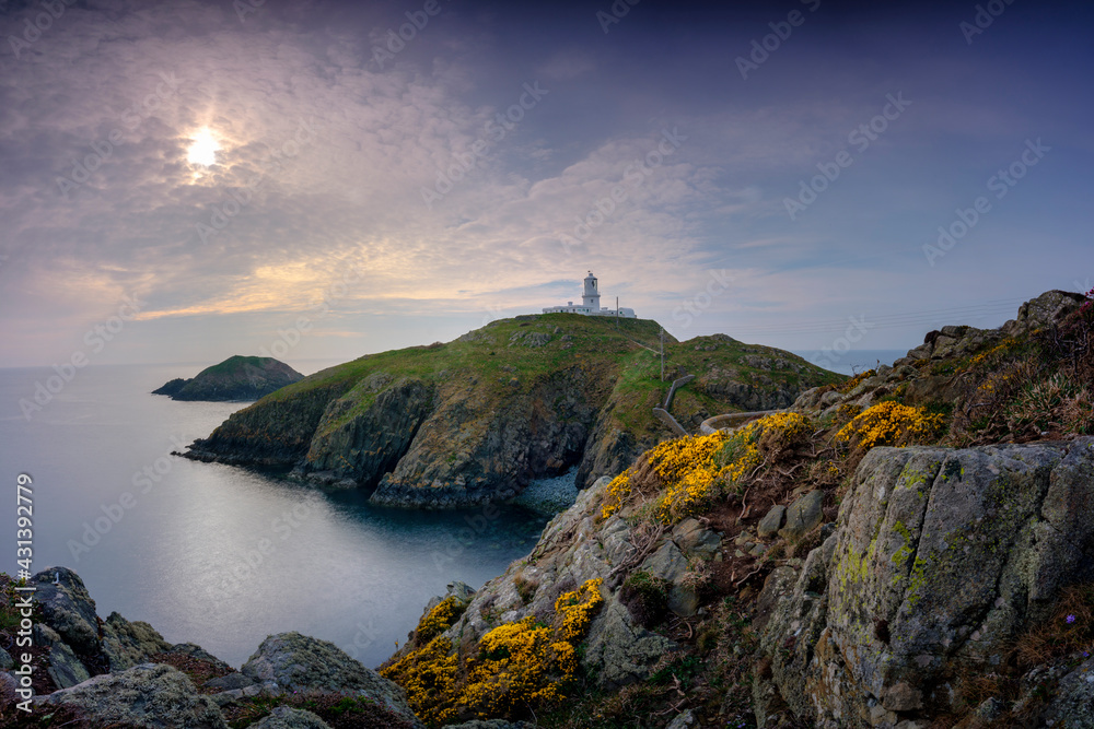 Sunset over Strumble Head light house, Wales, UK