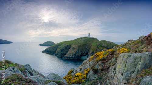 Sunset over Strumble Head light house, Wales, UK photo