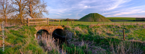Old Silbury Hill at sunset, near Avebury in Wiltshire, UK photo