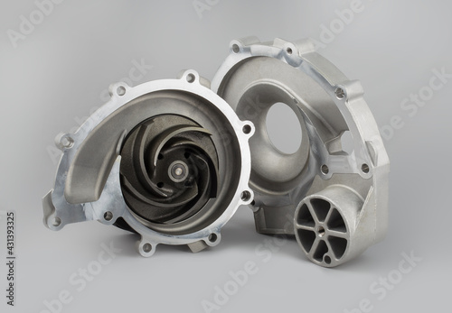 Water pump for truck on gray background. New truck parts. Car spare parts for repair