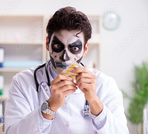 Scary monster doctor working in lab photo