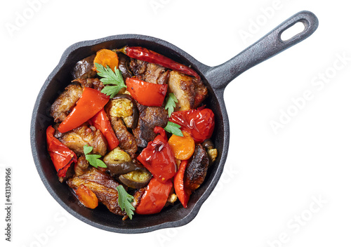 Pork with grilled vegetable stir fry on pan isolated on white, top vew