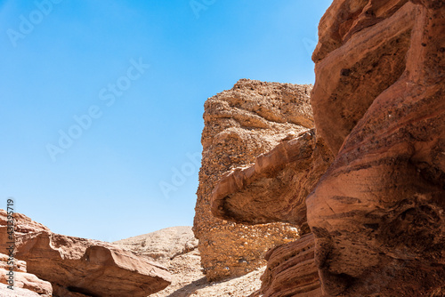 An amazing place in Israel is called the Red canyon and Nahal Shani  Southern District. Totally worth visiting because of its stunning stony structure. High quality photo