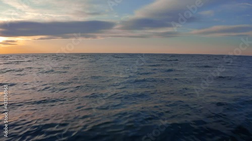 speeding up over the ocean water with drone