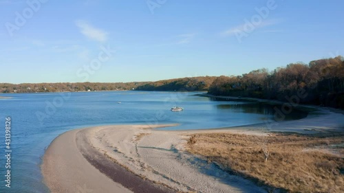 Sand bed and boating dock bay with blue water