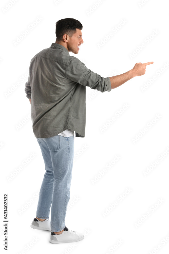 Emotional man pointing with index finger on white background Emotional man pointing with index finger on white background