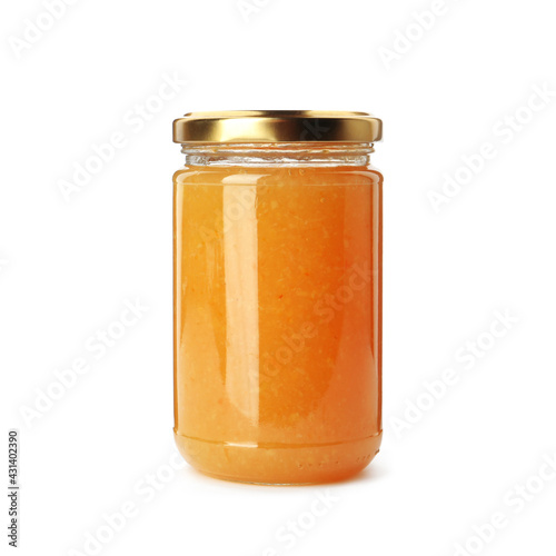 Delicious orange marmalade in jar on white background