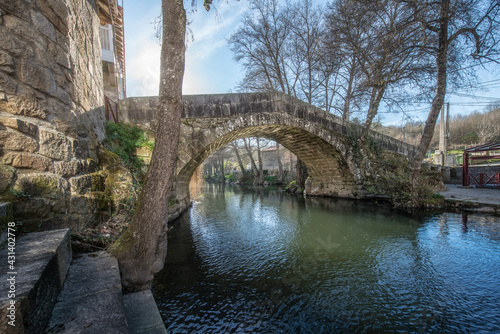 medieval stone bridge in the small and beautiful village of Baños de Molgas, Galicia, Spain.