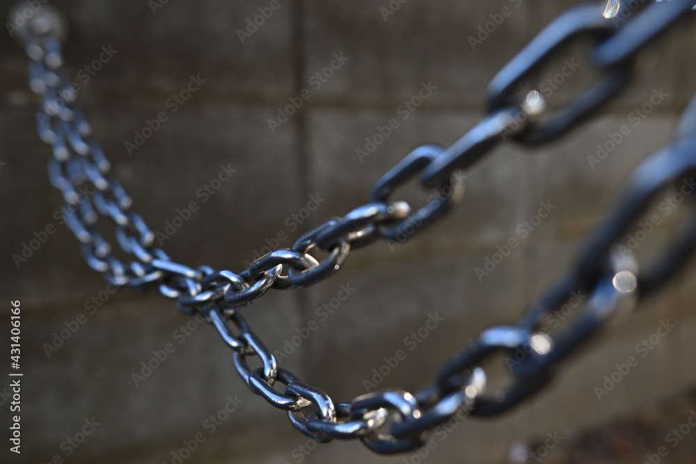 A chain in the shade. Image of a chain.