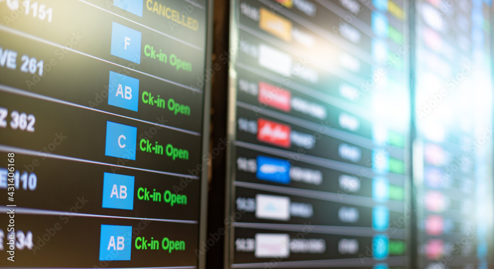 Airport flight information board or display and on time status. Different cities and destinations from all over the world. Airport flight information board or display and on time status. Different cities and destinations from all over the world.