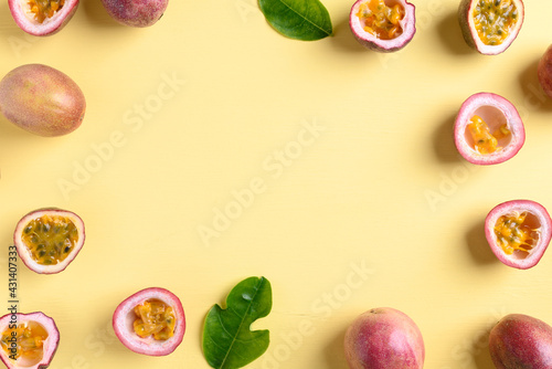 Fresh passion fruit on yellow background, Flat lay, Top view