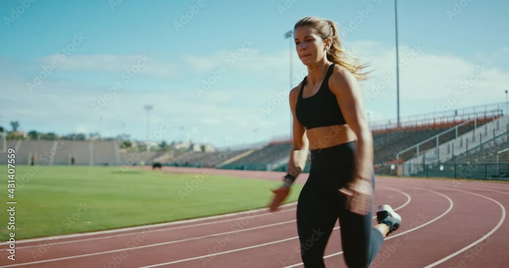 Young athletic woman running at the track, working hard and pushing the limits of her body, sprinting to the finish line, active lifestyle Young athletic woman running at the track, working hard and pushing the limits of her body, sprinting to the finish line, active lifestyle