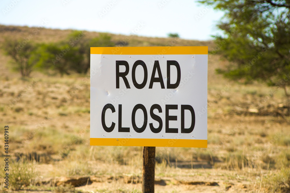 Sign post saying that the road is closed in the Kgalagadi Transfrontier Park. South Africa