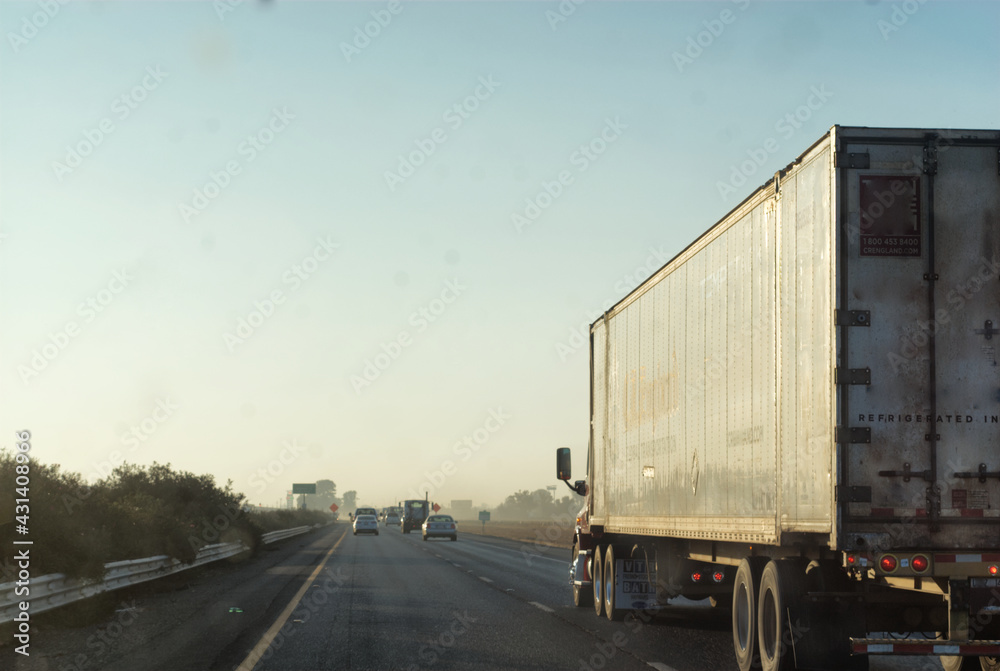 Truck traveling down the highway Truck traveling down the highway