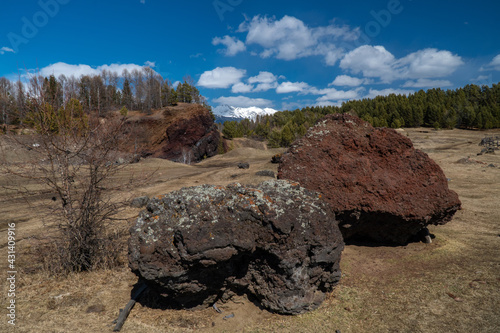 Large basalt stones next to an extinct volcano in the Tunkinskaya valley