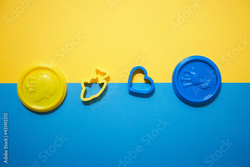 blue and yellow caps with play toys